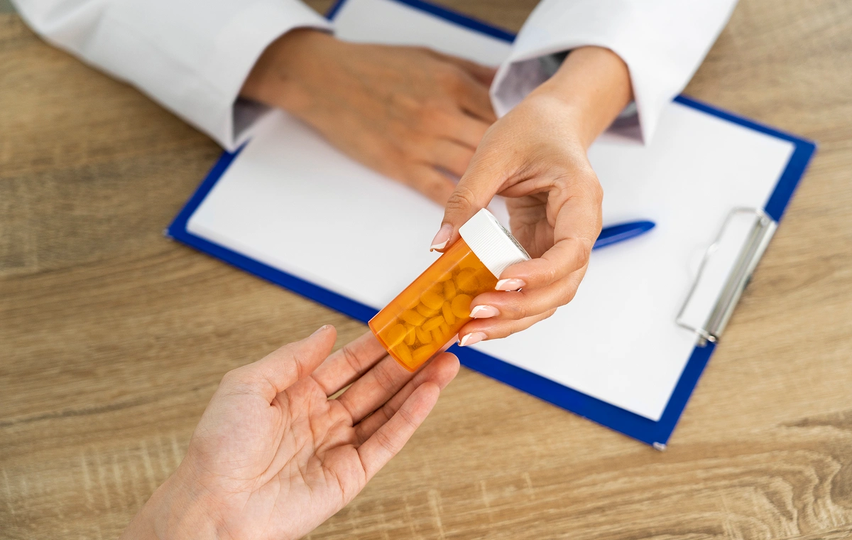 People holding weight loss pills